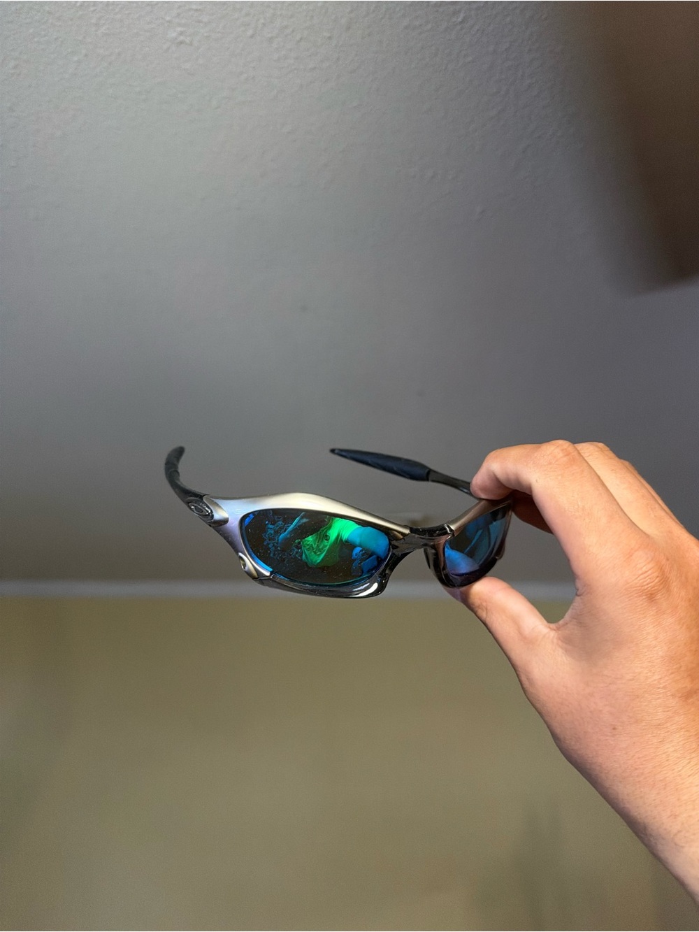 Oakley Titanium-Gray Frame Sunglasses with Blue-Green Mirrored Lenses